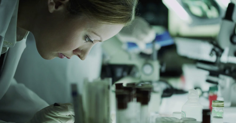 Researcher focused on work in a laboratory setting